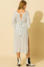 Load image into Gallery viewer, White and black polka dot pattern kimono with tie waist and side slit details.
