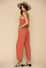 Load image into Gallery viewer, Brick color semi cropped jumpsuit with button &amp; waist ribbon detail and adjustable straps. Cotton blend.
