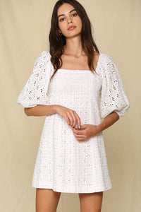 White lined eyelet dress with 3/4 sleeve.