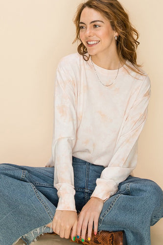 Blush colored long sleeve tie dye crew neck top with drop shoulder detail. 100% Cotton