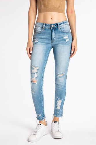 Light wash mid rise skinny jeans with some distressing