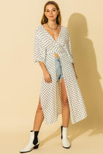 Load image into Gallery viewer, White and black polka dot pattern kimono with tie waist and side slit details.
