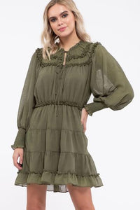 Olive colored tiered ruffle dress with tie details. Dress is lined.
