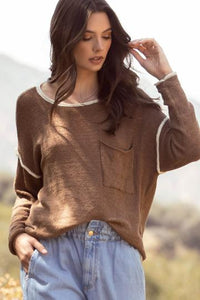 Almond colored contrast trim sweater with pocket