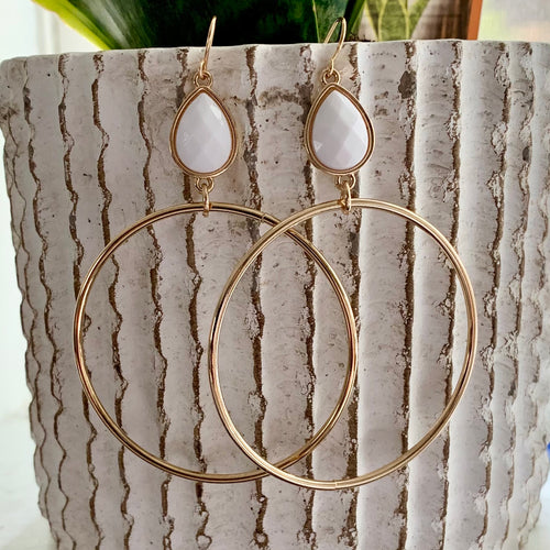 Gold drop circle earrings with acrylic teardrop accent.