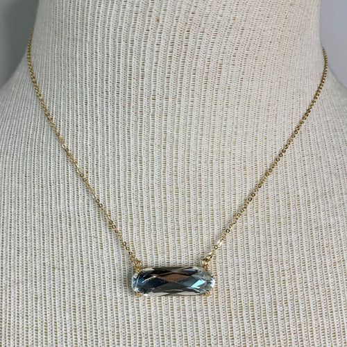 Gold faceted clear glass pendant necklace.  Necklace measures approx 16