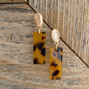 Acrylic dangle earrings with gold oval post detail.  Earring measures approx 1.5".  Metal Content: Blended Metal. Color: Tortoise