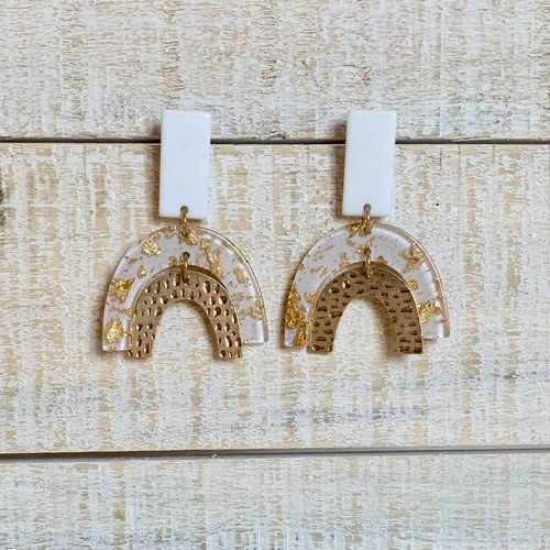 Gold fleck and clear resin arch earrings with gold arch & white post details.  Earring measures approx 2