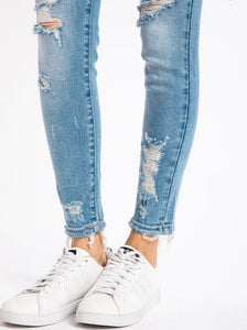 Light wash mid rise skinny jeans with some distressing