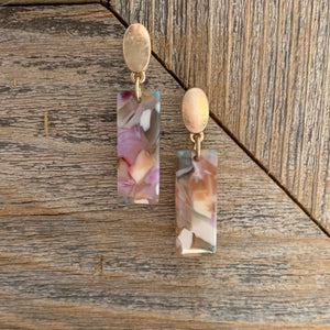 Acrylic dangle earrings with gold oval post detail.  Earring measures approx 1.5".  Metal Content: Blended Metal. Color: Blush