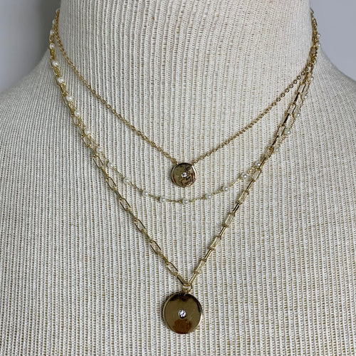 Gold 3 layer disk charm choker with clear crystal and pearl-like beads. Necklace measures approx 15